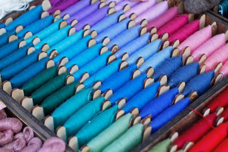 Multicolor sewing threads in a wooden box