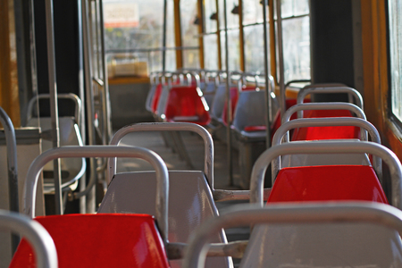 Row of seats in an empty tram cabinの写真素材