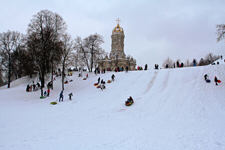 Podolsk, Moscow region, Russia - February 11, 2018: People snow-tubing in the winter park in Dubrovitsy village near Podolskのeditorial素材