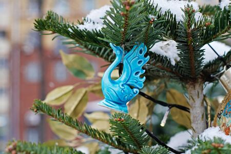 Moscow, Russia - December 19, 2018: Blue ceramic swan as Christmas toy hanging on a Christmas tree at the Festivalのeditorial素材