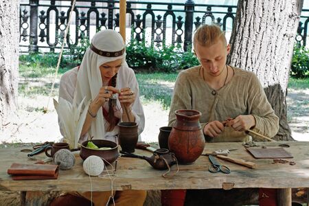 Moscow, Russia - June 11, 2019: Woman and man in traditional dress at the festivalのeditorial素材