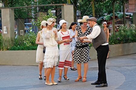 Moscow, Russia - June 11, 2019: Man and women dressed in 1920s fashion at the festivalのeditorial素材