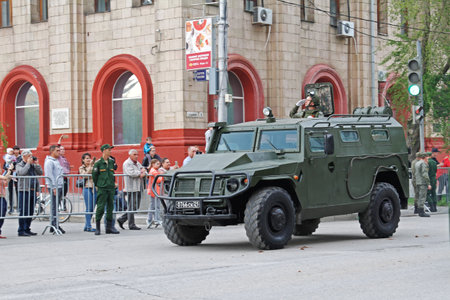 Volgograd, Russia - May 04, 2019: A soldier rides on an armored car