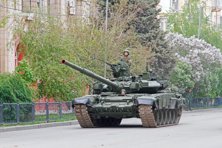 Volgograd, Russia - May 04, 2019: Soldiers ride an army tank during a dress rehearsal of a military...