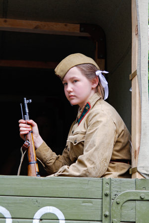 Volgograd, Russia - May 09, 2019: Soviet female soldier in uniform of World War II with a gun...