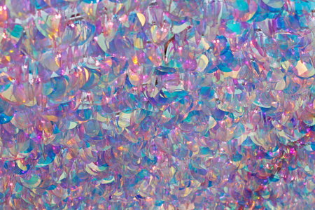 Pink and blue mother of pearl sequins background or texture