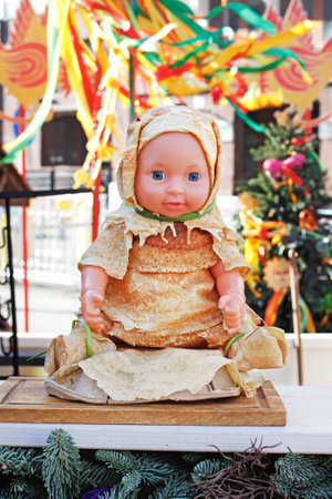 Moscow, Russia - February 25, 2020: Doll dressed in clothes made of pancakes at Russian national festival "Shrove" in Moscowのeditorial素材