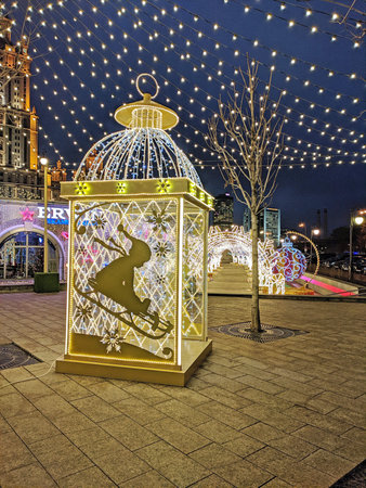 Moscow, Russia - December 13, 2019: Large LED candle holder stands as Christmas decoration on the street near the hotel "Ukraine" in Moscowのeditorial素材