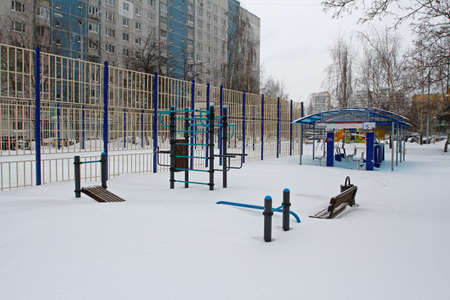 Vidnoe, Moscow region, Russia - February 13, 2021: Sports playground under snow after night snowstorm in the yard in Vidnoeのeditorial素材