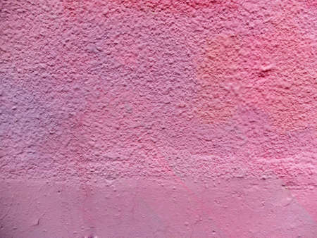 Purple and pink painted textured and smooth wall as background or textureの写真素材