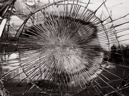 Broken mirror glass in which is reflected the city. Monochrome variant. Dark colors give a gloomy,...