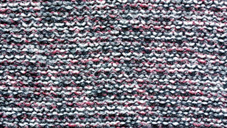 Variegated knitted fabric. Motley knit texture.の写真素材