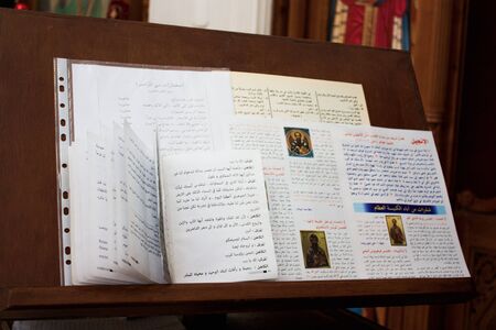 Various religious Scriptures lie on wooden stand for Bible in Church.の写真素材