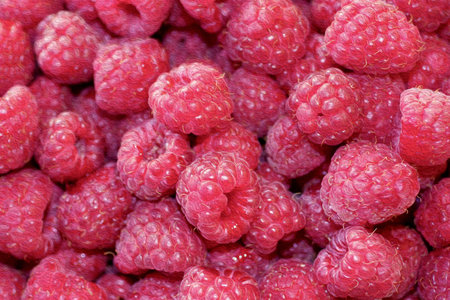 Natural background of sweet raspberry. Fresh and ripe red berries, closeup photo. Healthy, delicious...