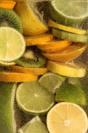 Water. Experiments with water. Lime, oranges. Fruit in water. Spray Drop of water. Water flow.の写真素材