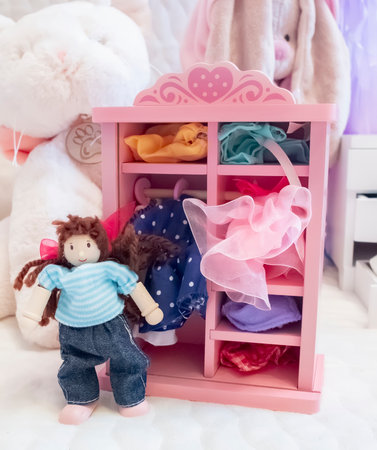 Cute little girl doll in the children's room. Selective focus.の写真素材