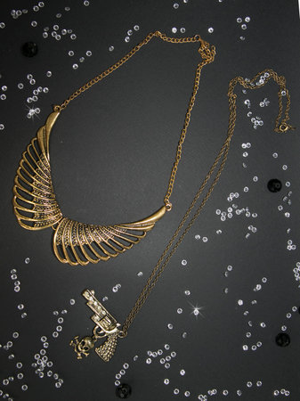 Gold necklace on a black background. Jewelry on a black background.の写真素材