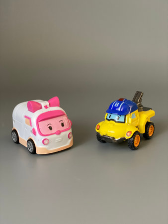 Plastic Toy Truck and Car on Gray Background, Transportation Concept.の写真素材