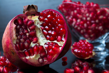 pomegranate fruit on a black background, close-upの写真素材