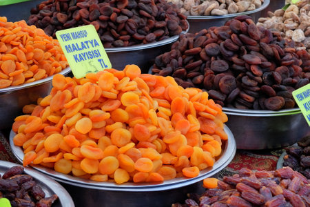 Dried apricots and dates on a market stall in Moroccoの写真素材
