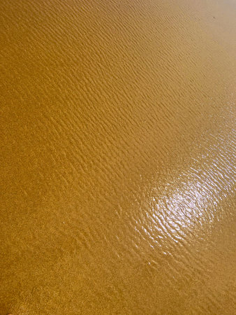 abstract texture of the water on the beach, closeup of photo