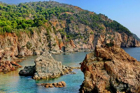 A rocky shore of the Mediterranean Sea and forbidding bay.の写真素材