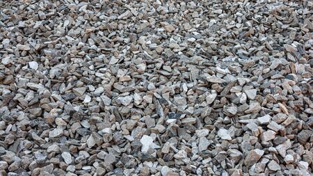 background texture of small stones of the sea coastの写真素材