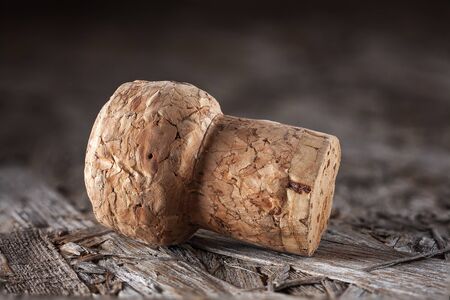 Champagne cork on a wooden background.の写真素材