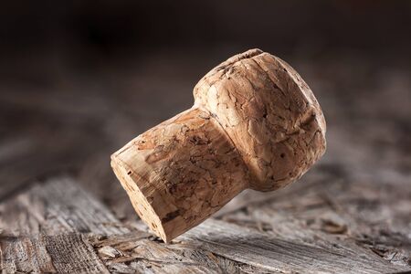 Champagne cork on a wooden background.の写真素材