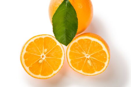 Isolated photo of a lemon cut in two with leaves on a white backgroundの写真素材