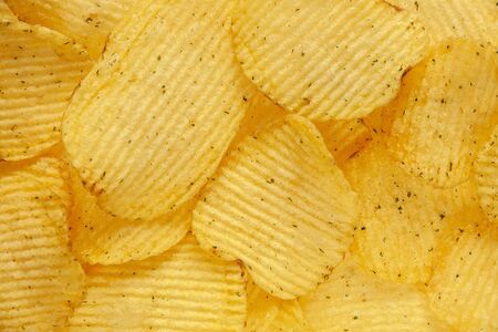 Fluted potato chips with dillの写真素材