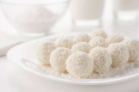 White small cakes sprinkled with coconut shavings.の写真素材