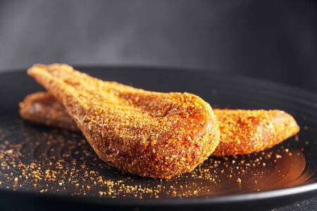 Basturma of chicken on a black plateの写真素材