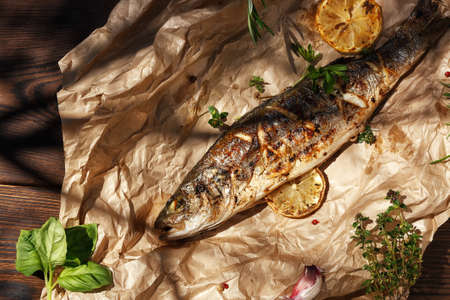 Sea Bass fish cooked on coals in a grillの写真素材
