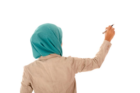 Business woman holding a pen pointing something on screenの写真素材