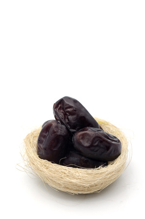 Dried dates isolated on white backgroundの写真素材