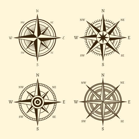 Compass icons. Hand drawn wind rose vintage style. West east and south north navigation, travel and adventure symbol, retro discovery element. Geography maps design, abstract logo vector isolated setのイラスト素材