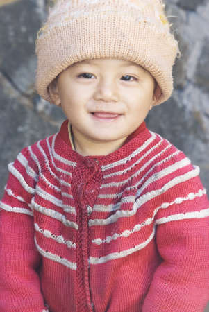 YUNNAN, CHINA - Oct.,22, 2010 - Chinese little boy smiling in a village.のeditorial素材
