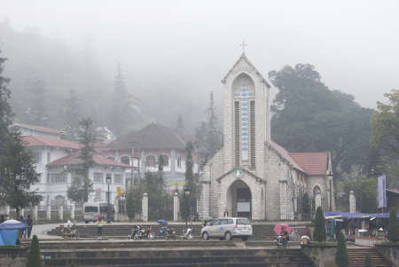 SAPA, VIETNAM - Oct.25, 2010 : Sapa  Catholic Church, Lao Cai, Vietnam, surrounding by mist in winter.のeditorial素材