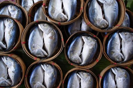 Short mackerel prepared as Pla Thu on bamboo basket.の写真素材