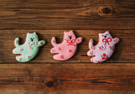 gift gingerbread in the glaze three cats of different colors with bows and flowers handmade
