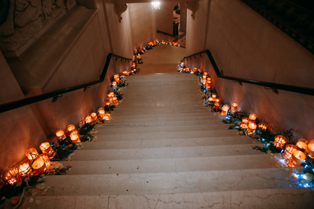 decor for a holiday stairs down with candles and rose petalsの写真素材