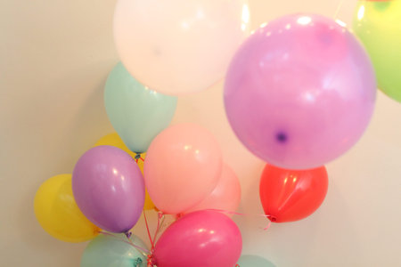 multi-colored balloons helium ribbons fly celebrationの写真素材