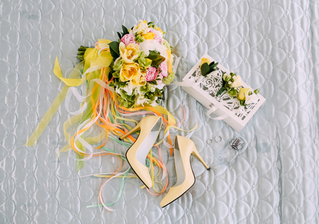 collections of bride objects flowers shoes rings of perfume on a white backgroundの写真素材