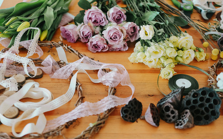 florist collects a bouquet decorates from different flowersの写真素材