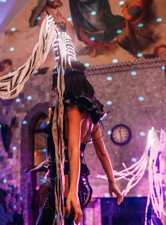 girl dancer on stage in an erotic show in a suit with accessoriesの写真素材