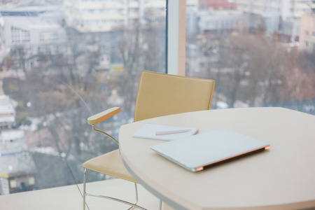 working environment in a stylish office with items on the tableの写真素材