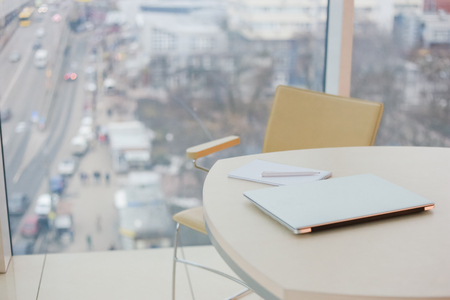 working environment in a stylish office with items on the tableの写真素材