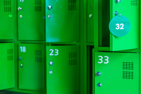 Boxes with locks for personal belongings in the market in green styleの写真素材