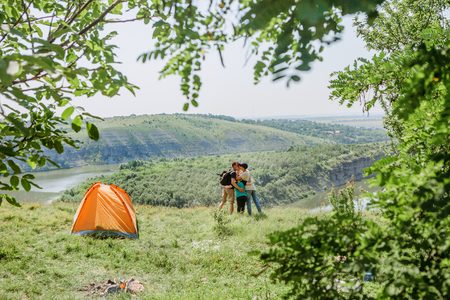 overnight family in a tent in the wild and dawn by the river with a beautiful sceneryの写真素材